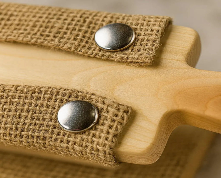 Close-up of food-grade burlap weave attached to a cedar bagel board with stainless steel snaps.